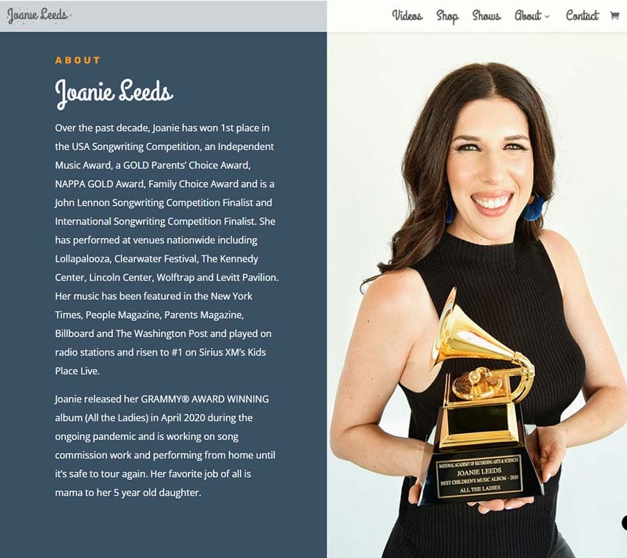 The About page on JoanieLeeds.com: a bio beside a portrait of the musician holding a Grammy.