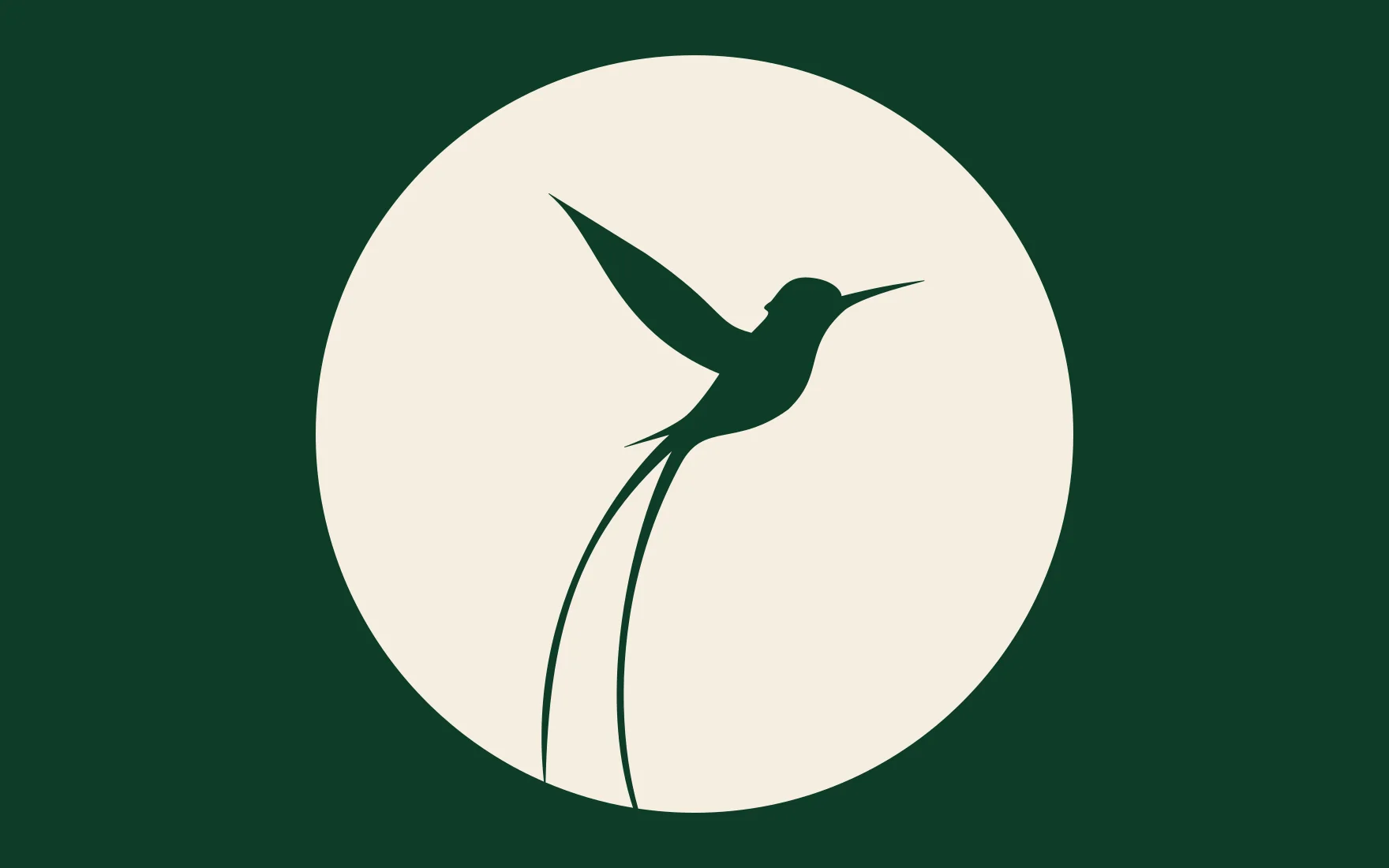 The finished doctor bird mark: a cream disc with a hummingbird cut out of it, wing raised and a long tail streaming down, on the deep green of the cover.